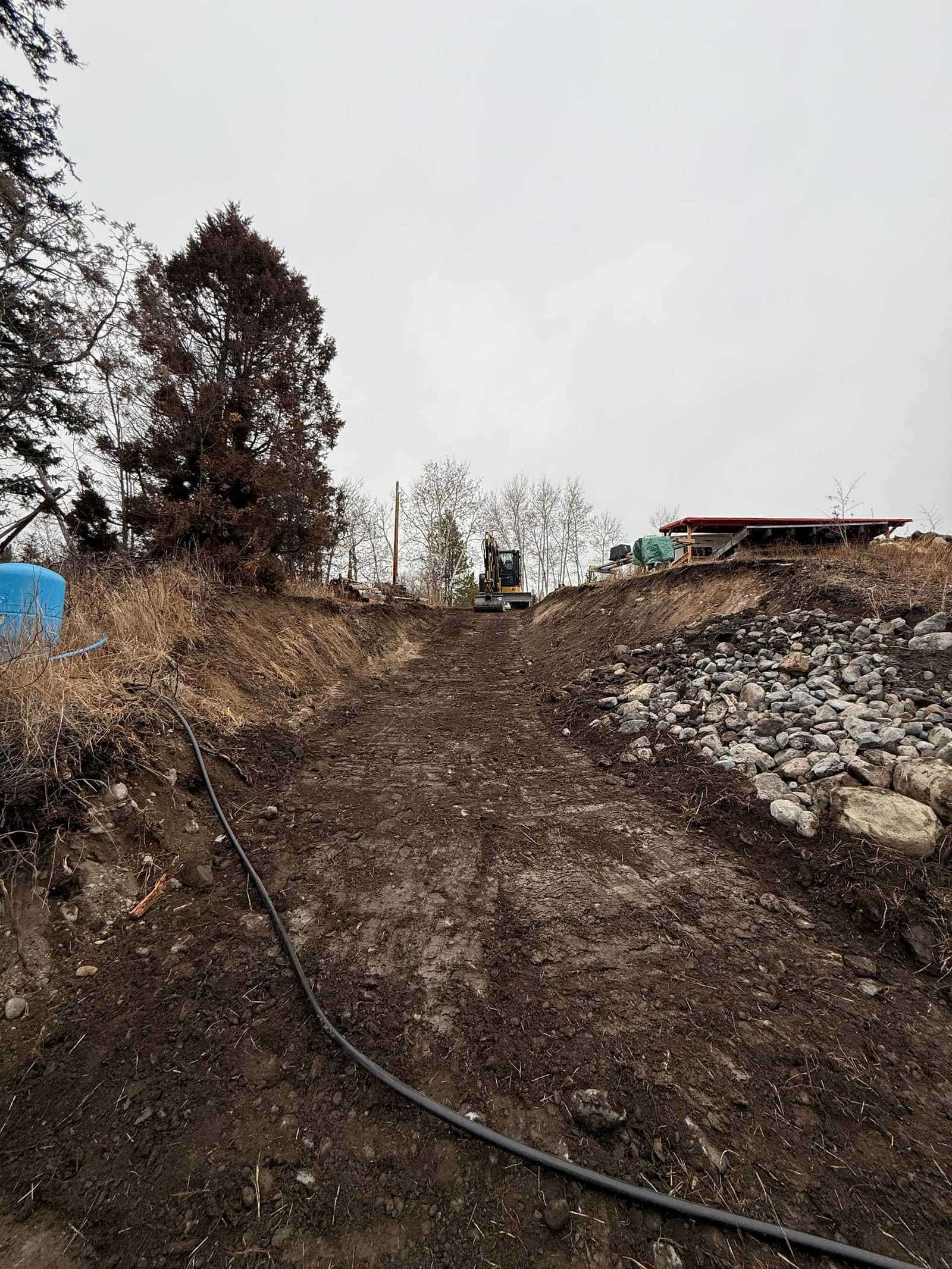 Excavated access path down to lakeshore with rock armouring